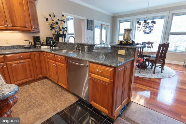 a bedroom with a bed and a flat screen tv on dresser