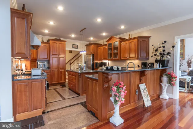 a spacious bedroom with a bed and a chandelier