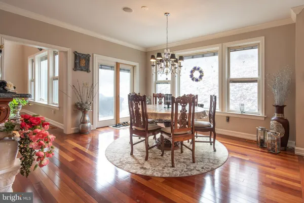 a view of an entryway with wooden floor