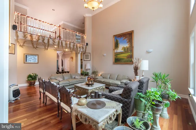 a living room with furniture gym equipment and a flat screen tv