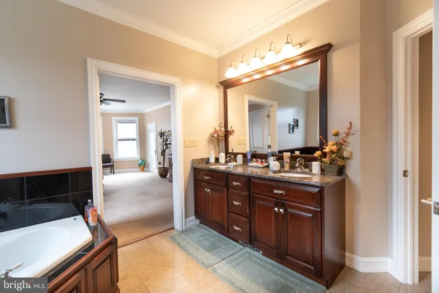 a bathroom with a bathtub and a sink