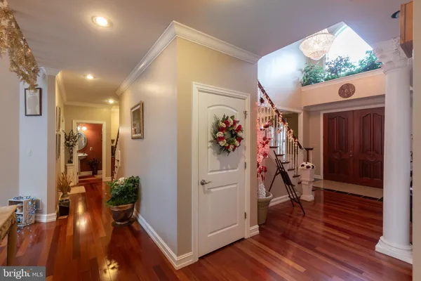 a bathroom with a granite countertop sink toilet and mirror