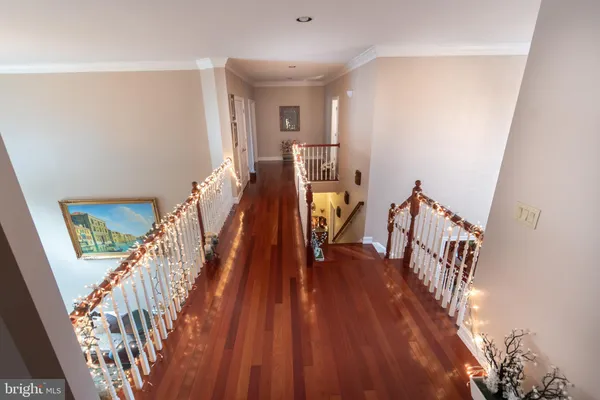 a spacious bedroom with a bed and a ceiling fan