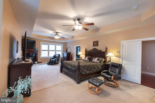 a spacious bedroom with a bed and a window