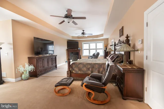 a view of a hallway with entryway wooden floor and front door