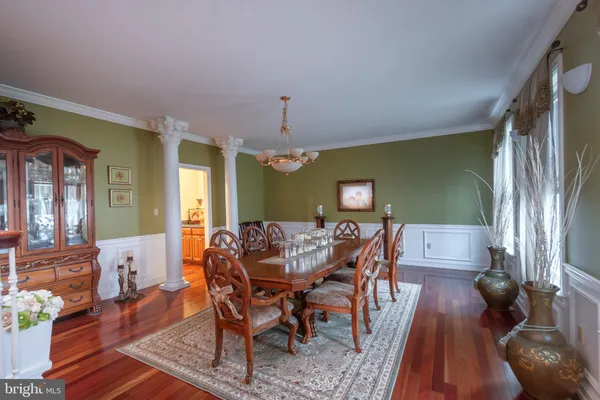 a bathroom with a toilet a sink and a mirror