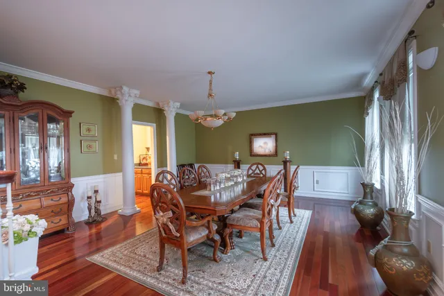 a bathroom with a toilet a sink and a mirror