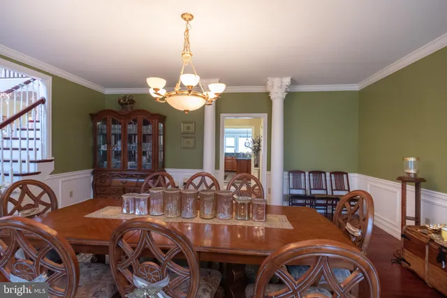 a kitchen with stainless steel appliances granite countertop a stove a sink dishwasher and a refrigerator