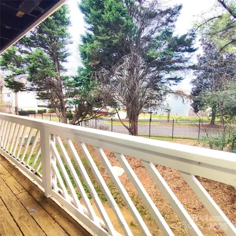 a view of a yard with a large trees