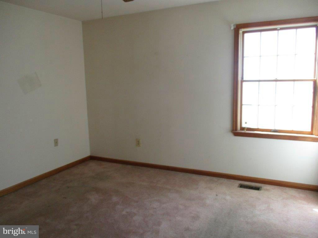 3223 Lynch Road Baltimore, MD 21219 - Photo 13 of 15 an empty room with a window