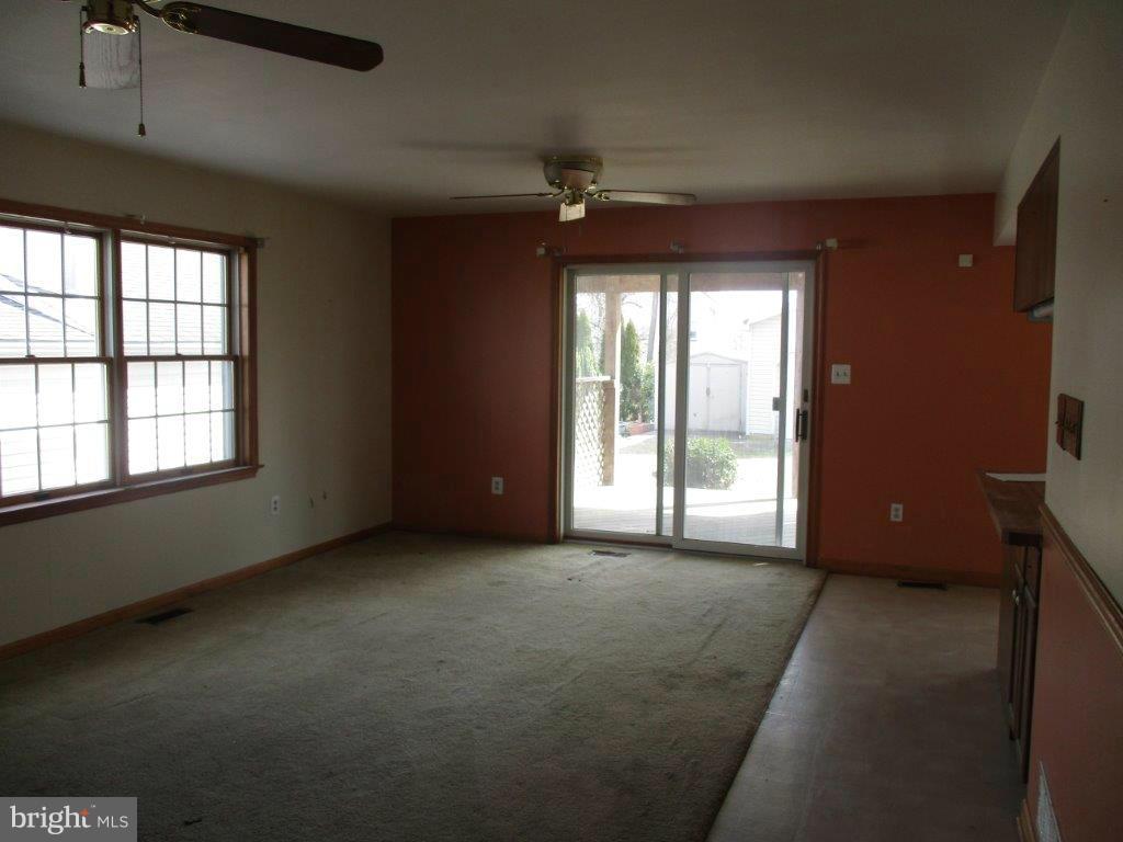3223 Lynch Road Baltimore, MD 21219 - Photo 4 of 15 a view of an empty room with a window