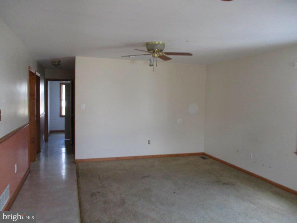 3223 Lynch Road Baltimore, MD 21219 - Photo 5 of 15 wooden floor in an empty room