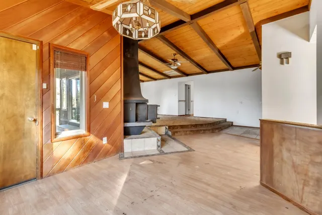 a view of a patio with a table and chairs