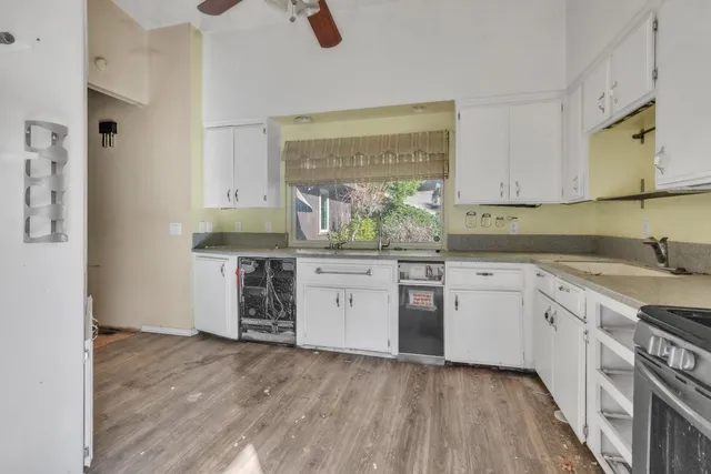 a kitchen with a stove a sink and a refrigerator