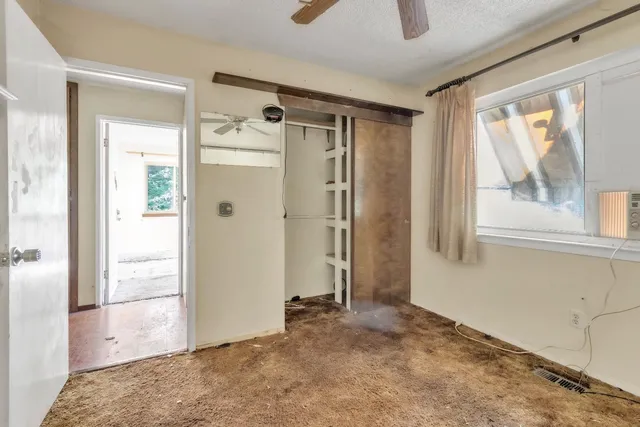 a view of an empty room and window