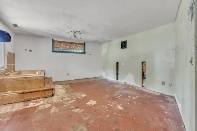 a bedroom with a bed and a cabinets