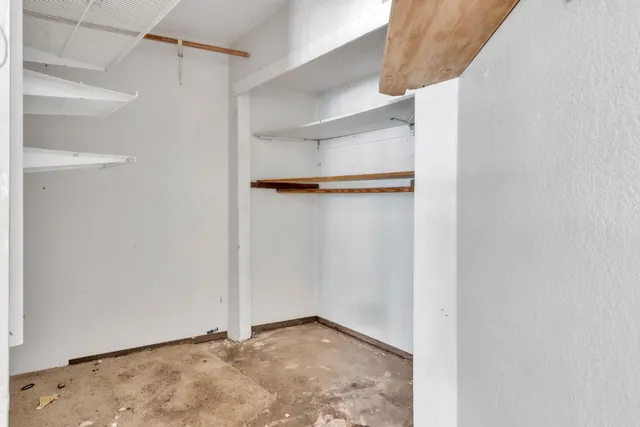 a view of an empty walk in closet