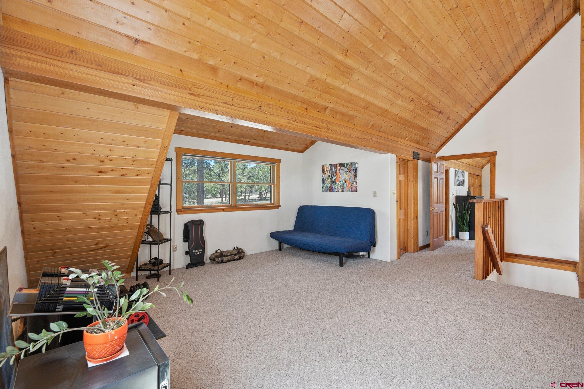 32 Meadows Road Durango, CO 81301 - Photo 17 of 35 a bed room with a bed and a window