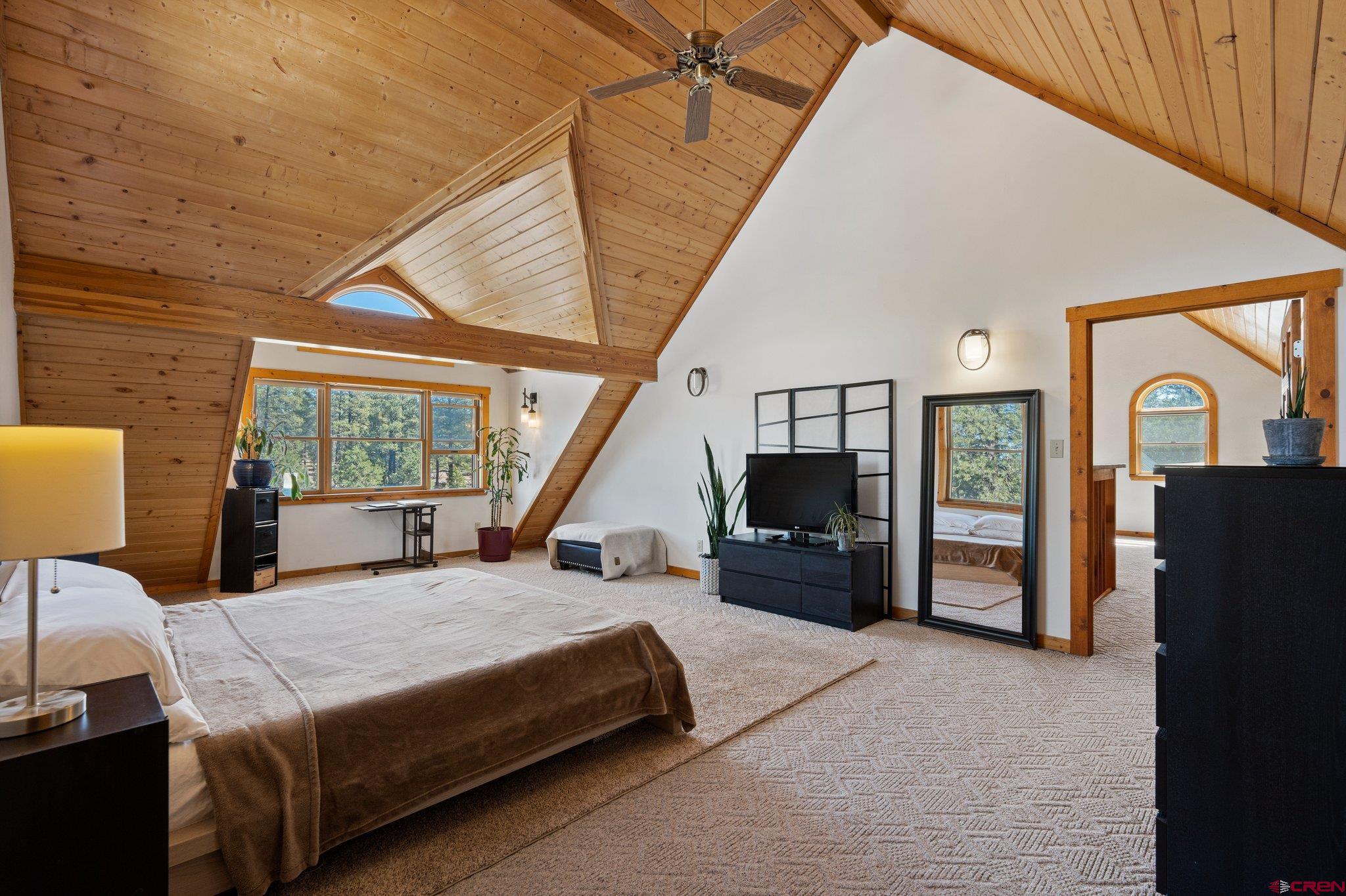 32 Meadows Road Durango, CO 81301 - Photo 19 of 35 a bedroom with a bed a couch and dresser