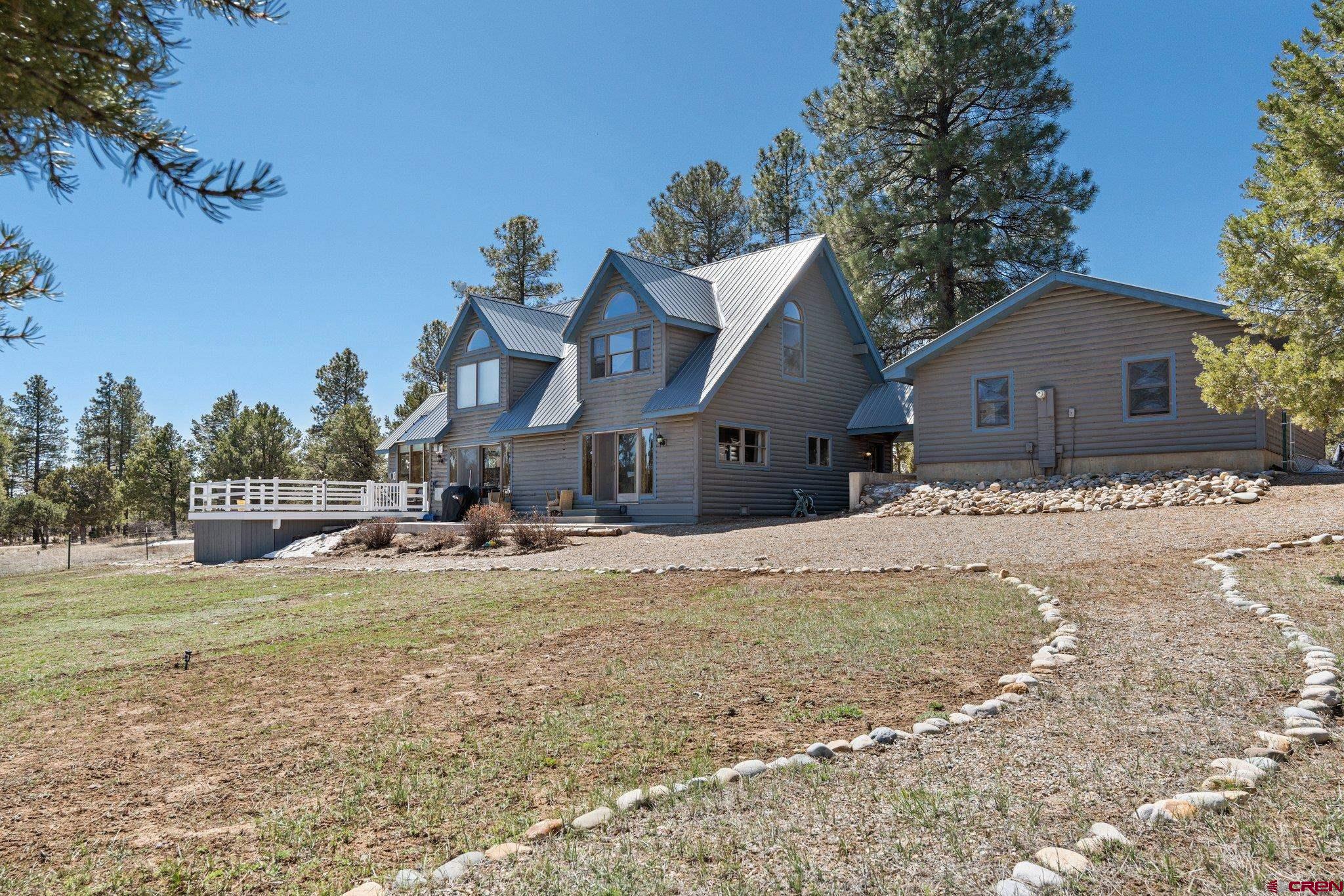 32 Meadows Road Durango, CO 81301 - Photo 29 of 35 a view of a house with a yard and sitting area