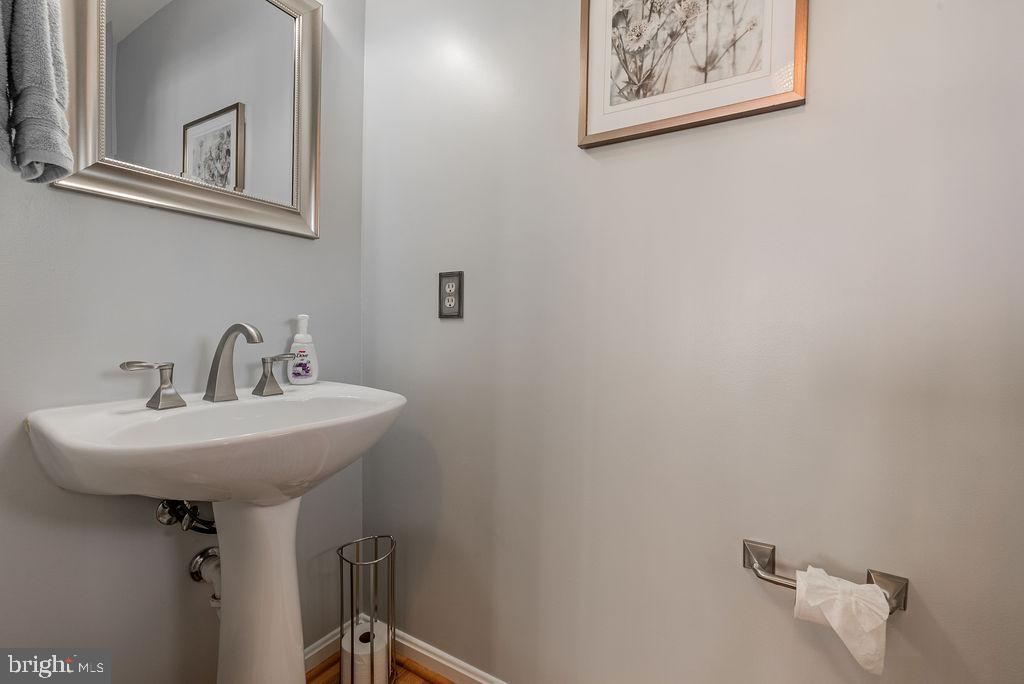 9629 Utica Place Springdale, MD 20721 - Photo 21 of 50 Powder room on main level
