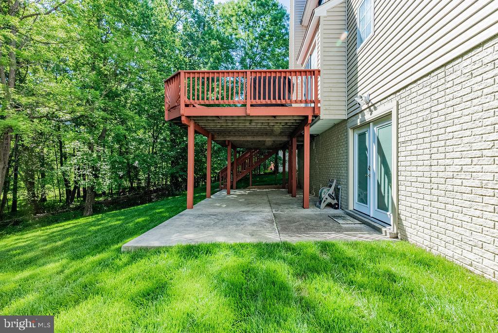 9629 Utica Place Springdale, MD 20721 - Photo 4 of 50 Back view showing patio off walk out basement