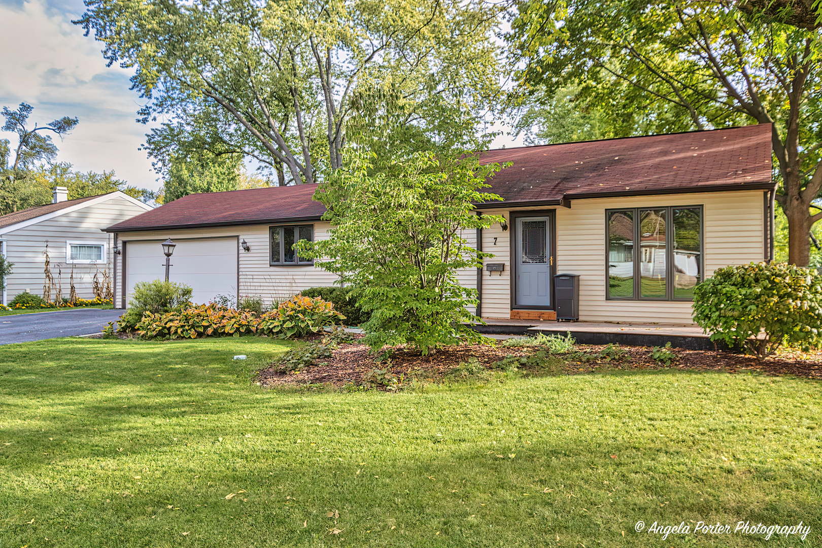 7 Manor Road Lake Zurich, IL 60047 - Photo 2 of 27 a view of a house with garden and trees