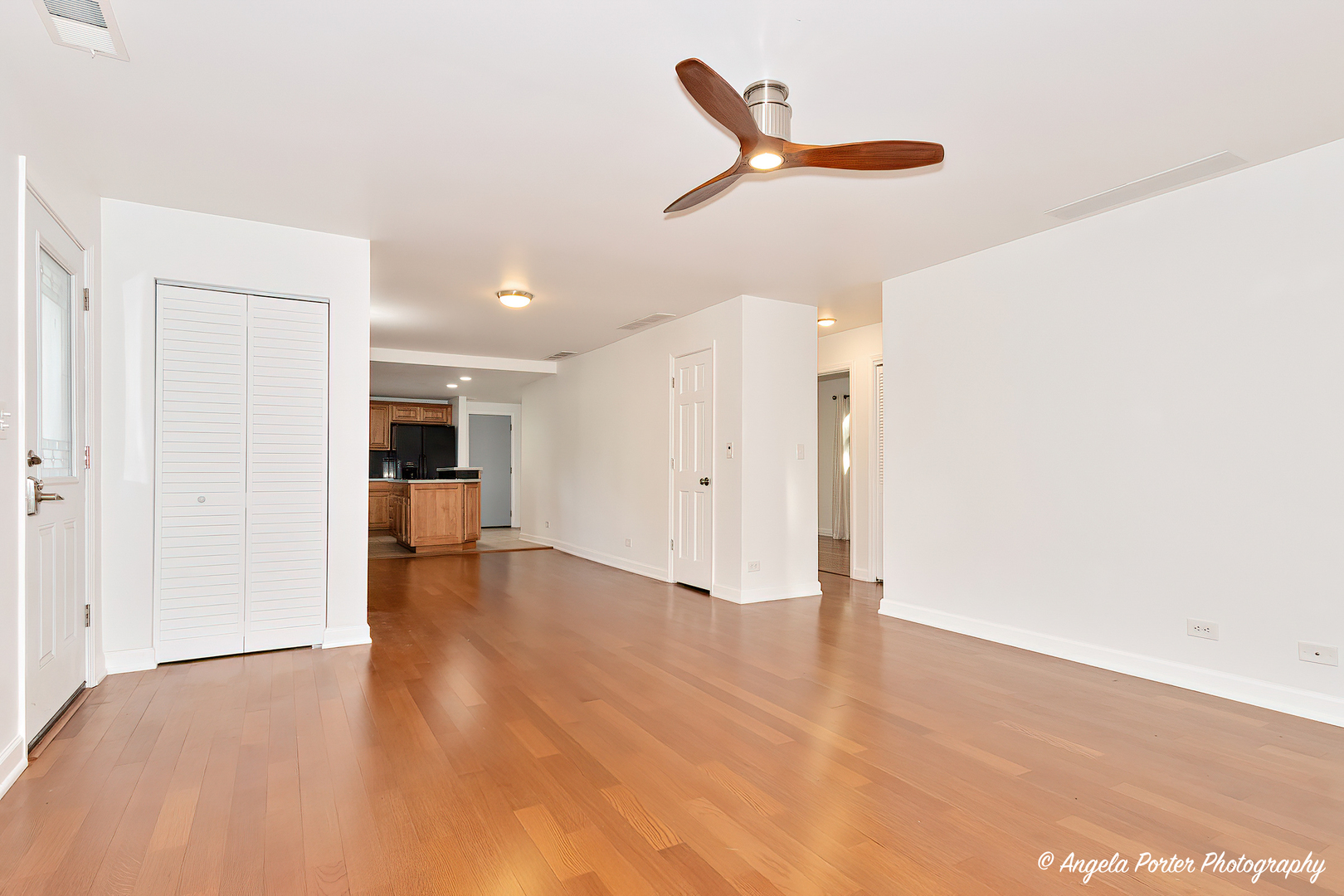 7 Manor Road Lake Zurich, IL 60047 - Photo 5 of 27 a view of a livingroom with a ceiling fan and wooden floor