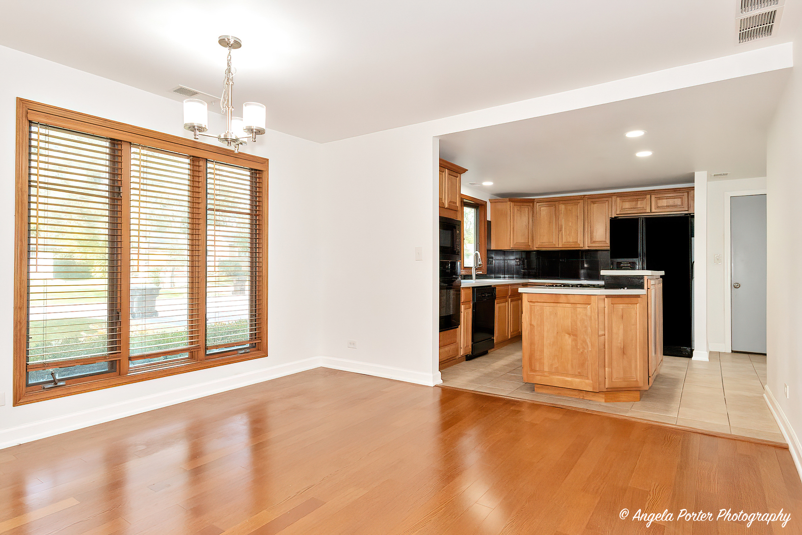 7 Manor Road Lake Zurich, IL 60047 - Photo 7 of 27 a view of kitchen with kitchen island granite countertop a stove top oven a sink and a counter space