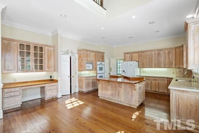 a living room with furniture and large windows