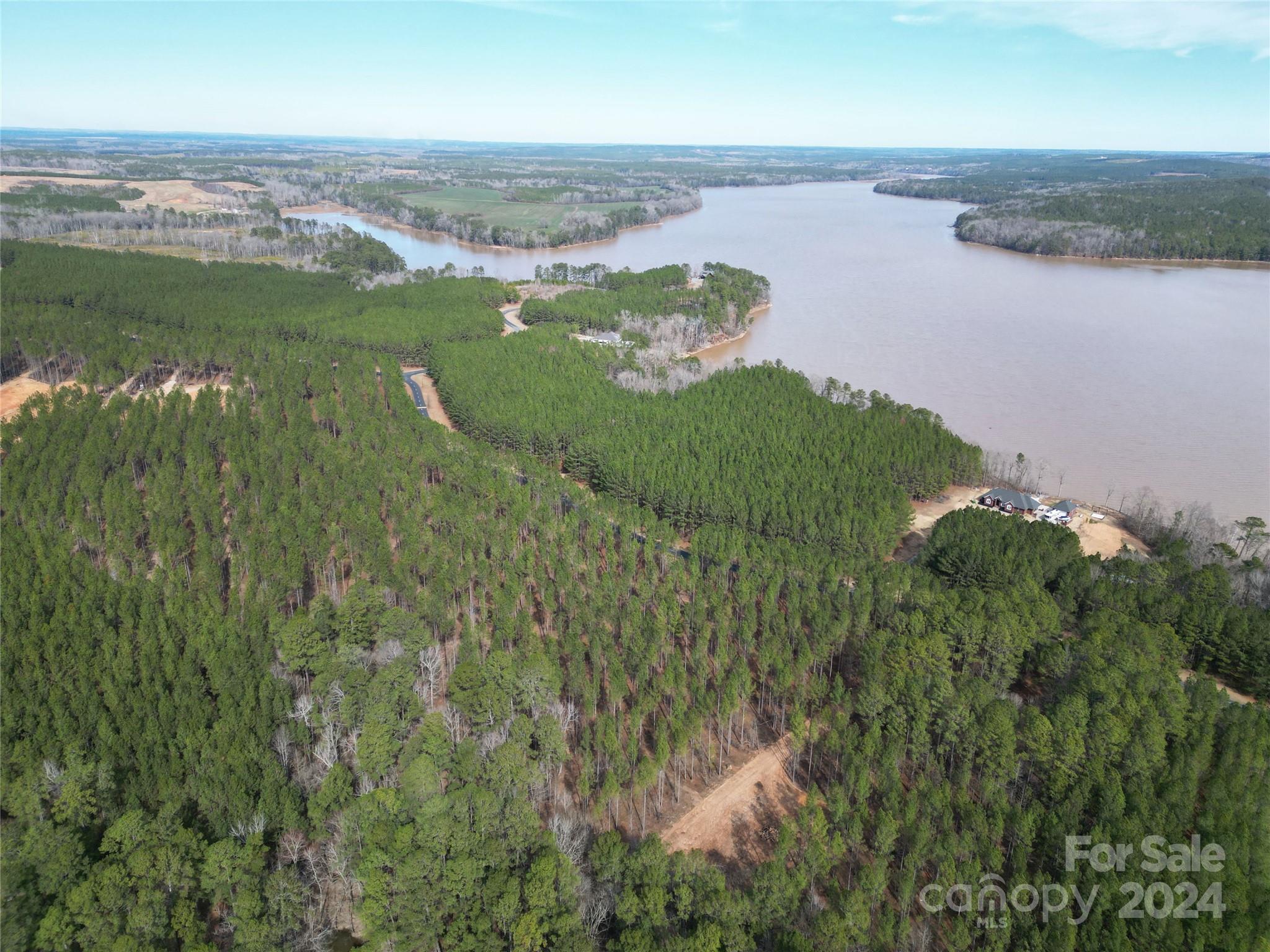 Tbd Tbd Spencer Pointe Road, Unit LOT 20C Lilesville, NC 28091 - Photo 14 of 22 a view of a lake with a city
