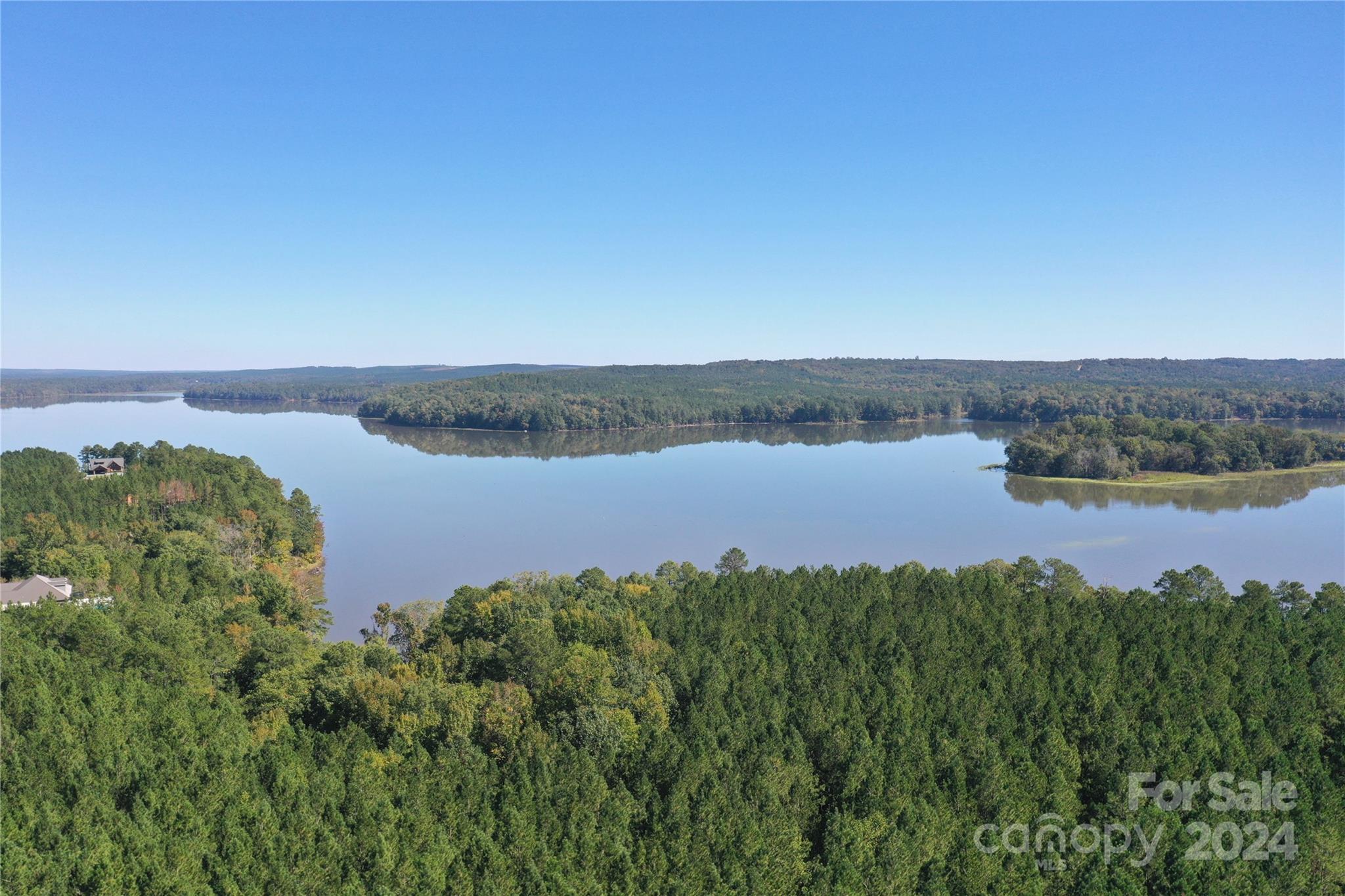 Tbd Tbd Spencer Pointe Road, Unit LOT 20C Lilesville, NC 28091 - Photo 19 of 22 a view of a lake with houses in the back