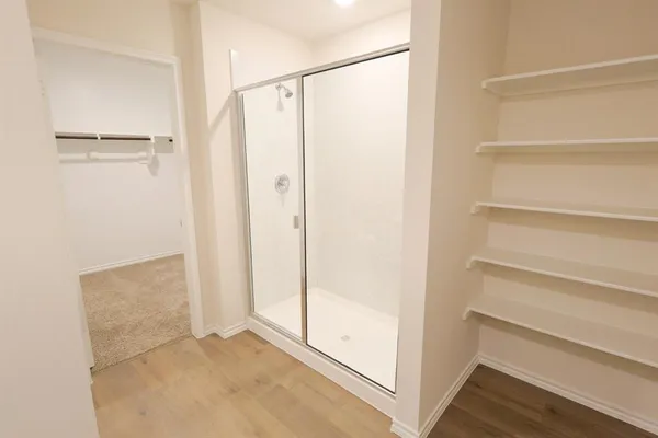 a view of closet area with empty racks