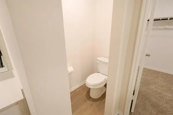 a bathroom with a toilet and a sink