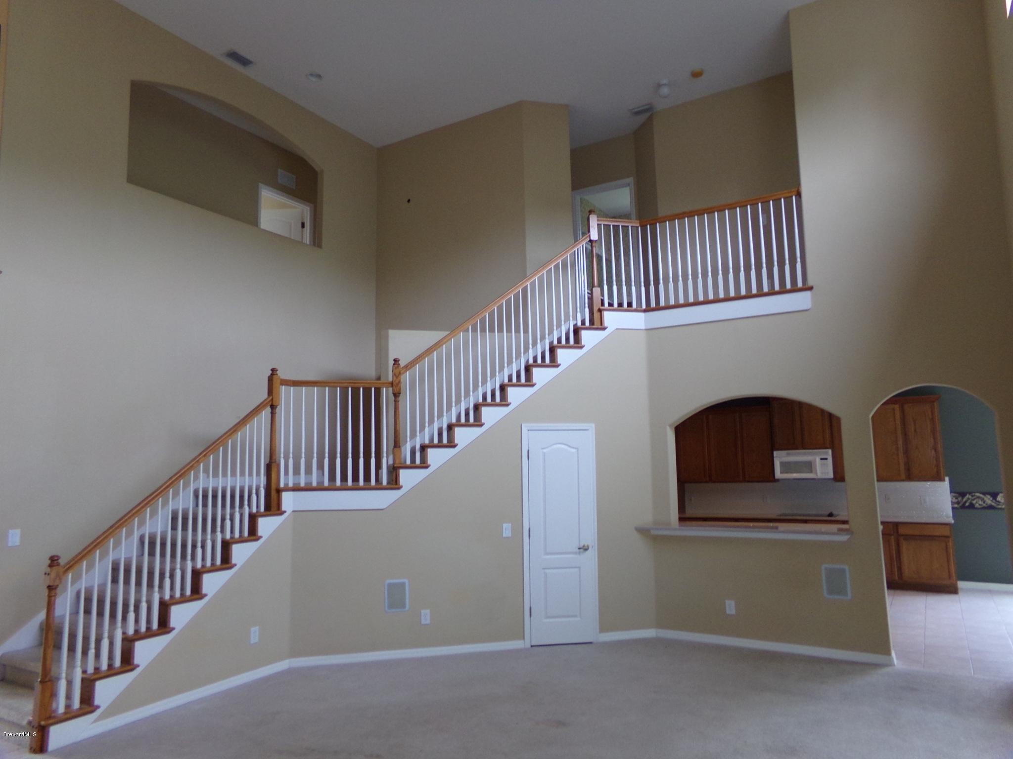 3995 Harlock Road Melbourne, FL 32934 - Photo 11 of 34 a view of entryway and hall with wooden floor