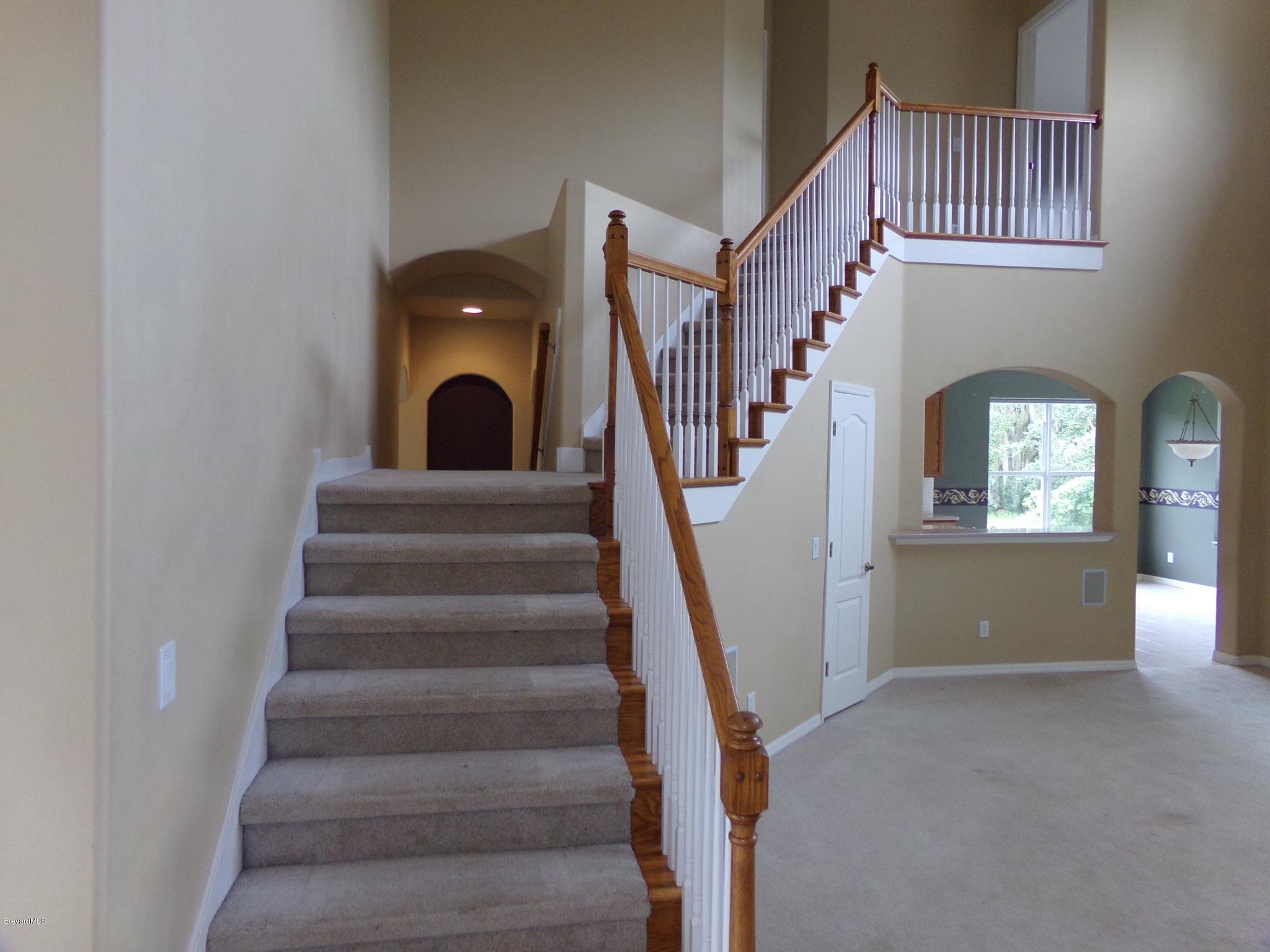 3995 Harlock Road Melbourne, FL 32934 - Photo 12 of 34 a view of entryway and hall with wooden floor