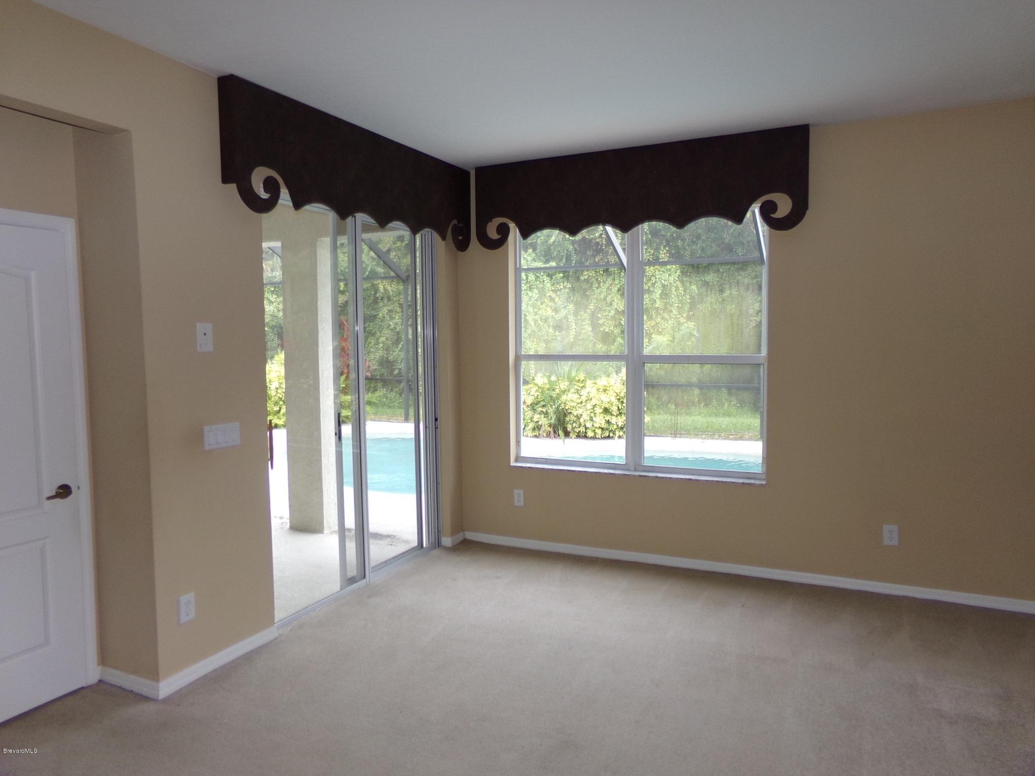3995 Harlock Road Melbourne, FL 32934 - Photo 16 of 34 a view of an empty room and window
