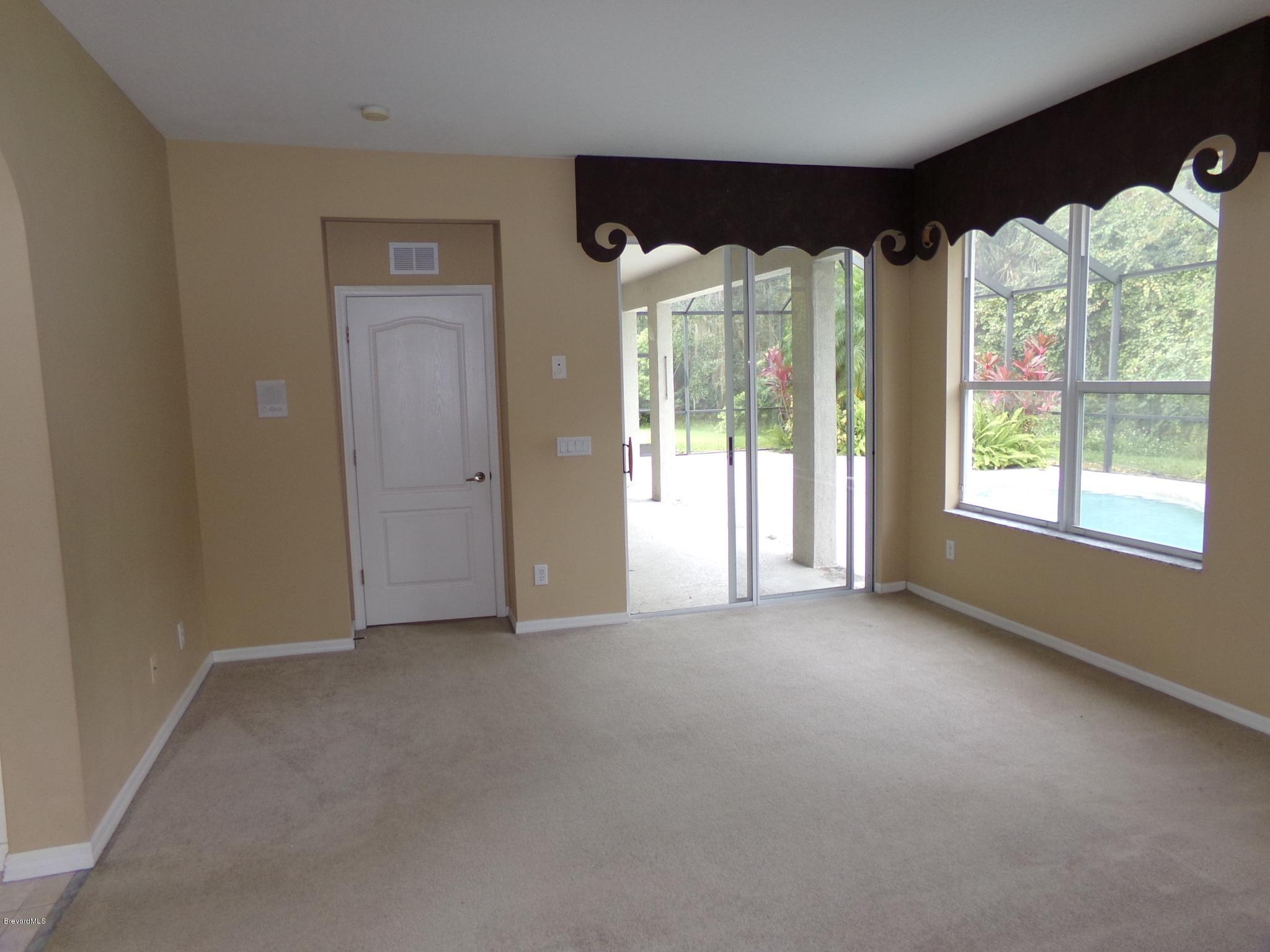 3995 Harlock Road Melbourne, FL 32934 - Photo 17 of 34 an empty room with windows