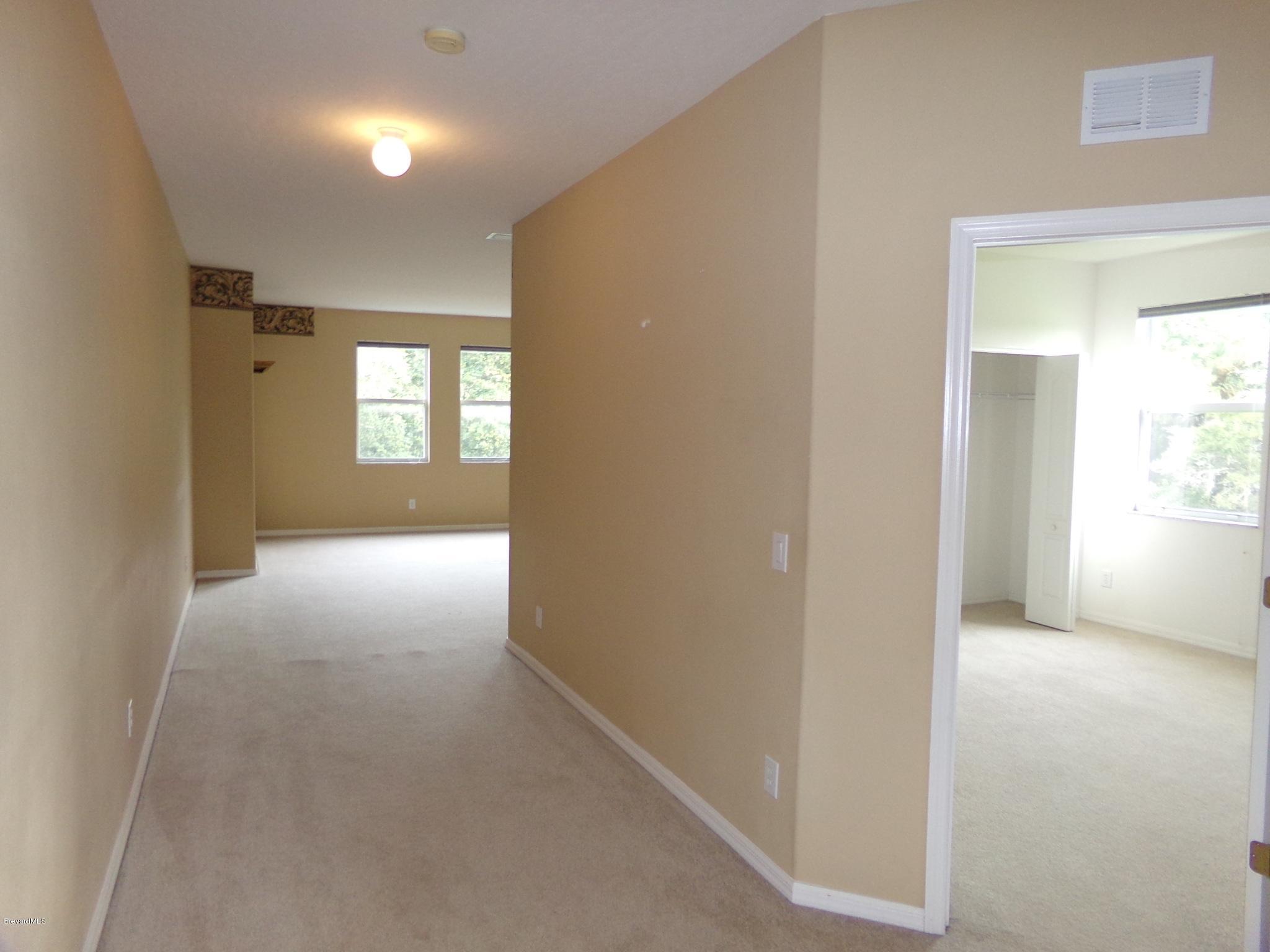 3995 Harlock Road Melbourne, FL 32934 - Photo 24 of 34 a view of hallway with windows