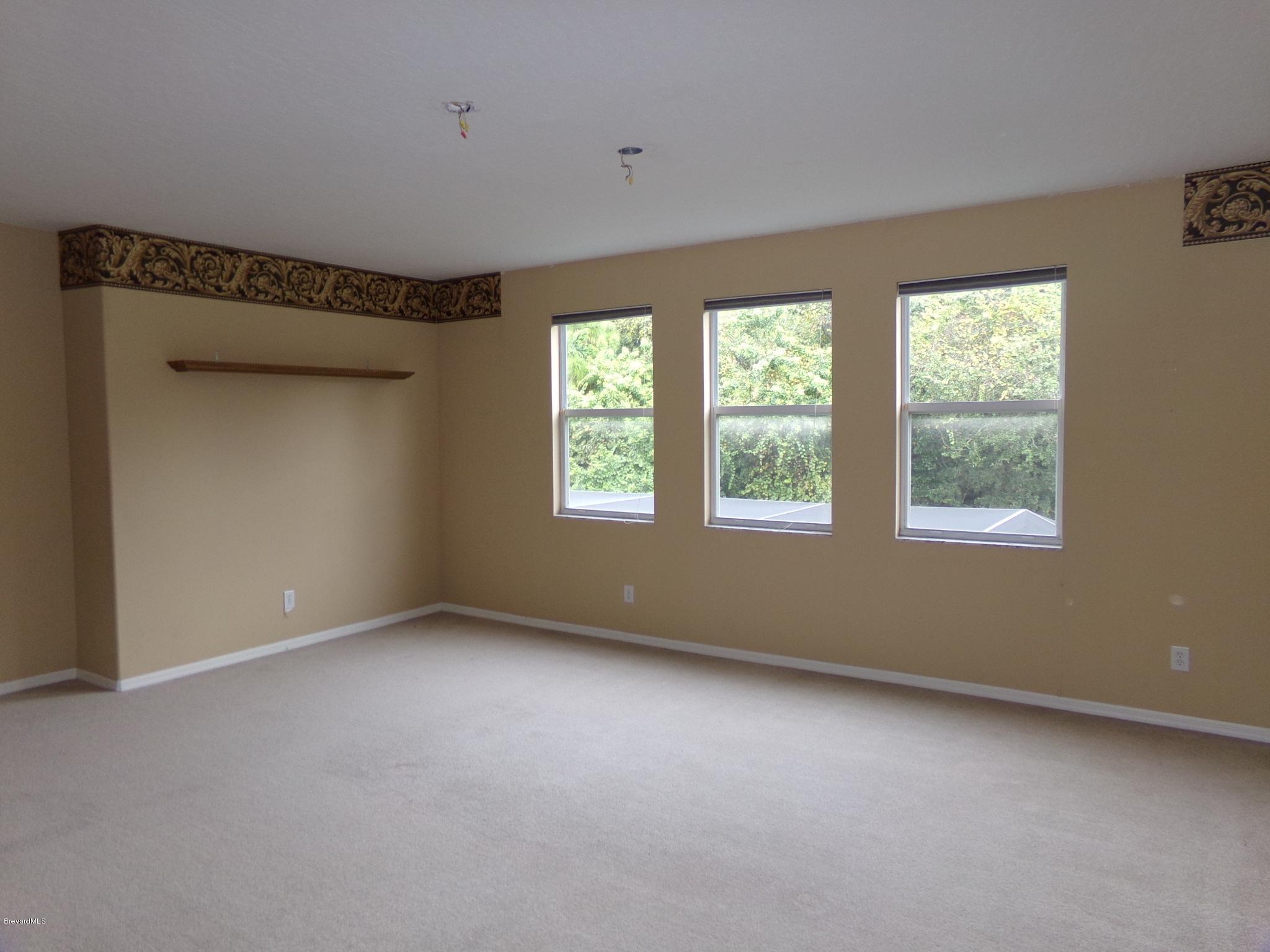 3995 Harlock Road Melbourne, FL 32934 - Photo 25 of 34 a view of an empty room with a window