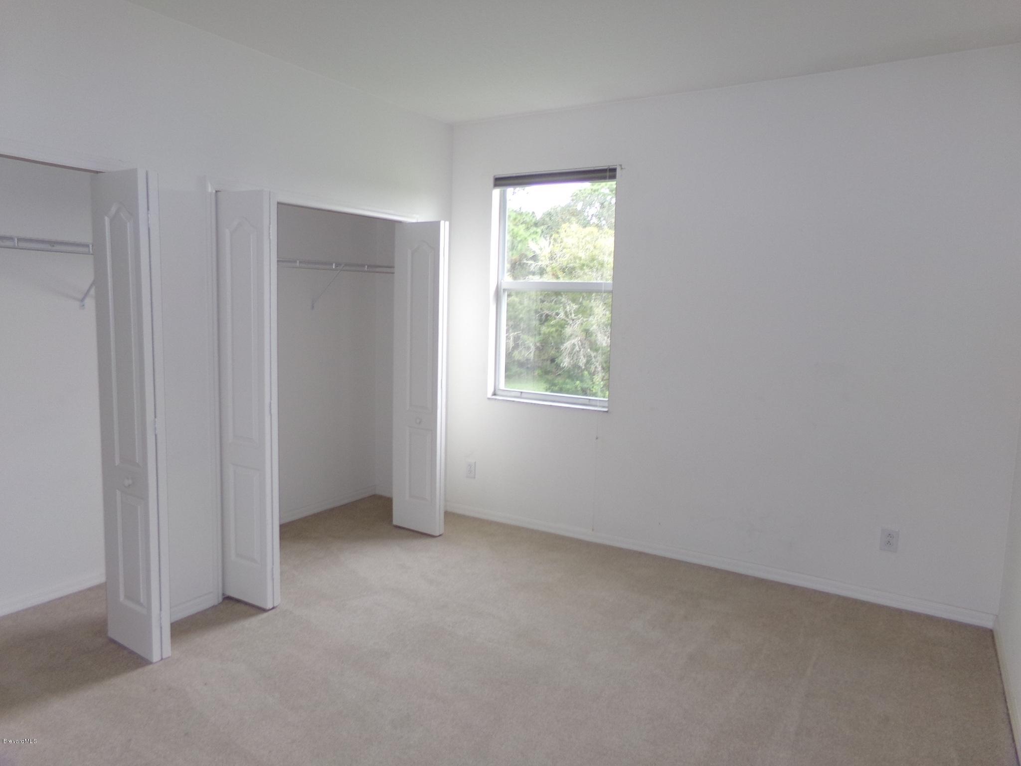 3995 Harlock Road Melbourne, FL 32934 - Photo 26 of 34 an empty room with windows