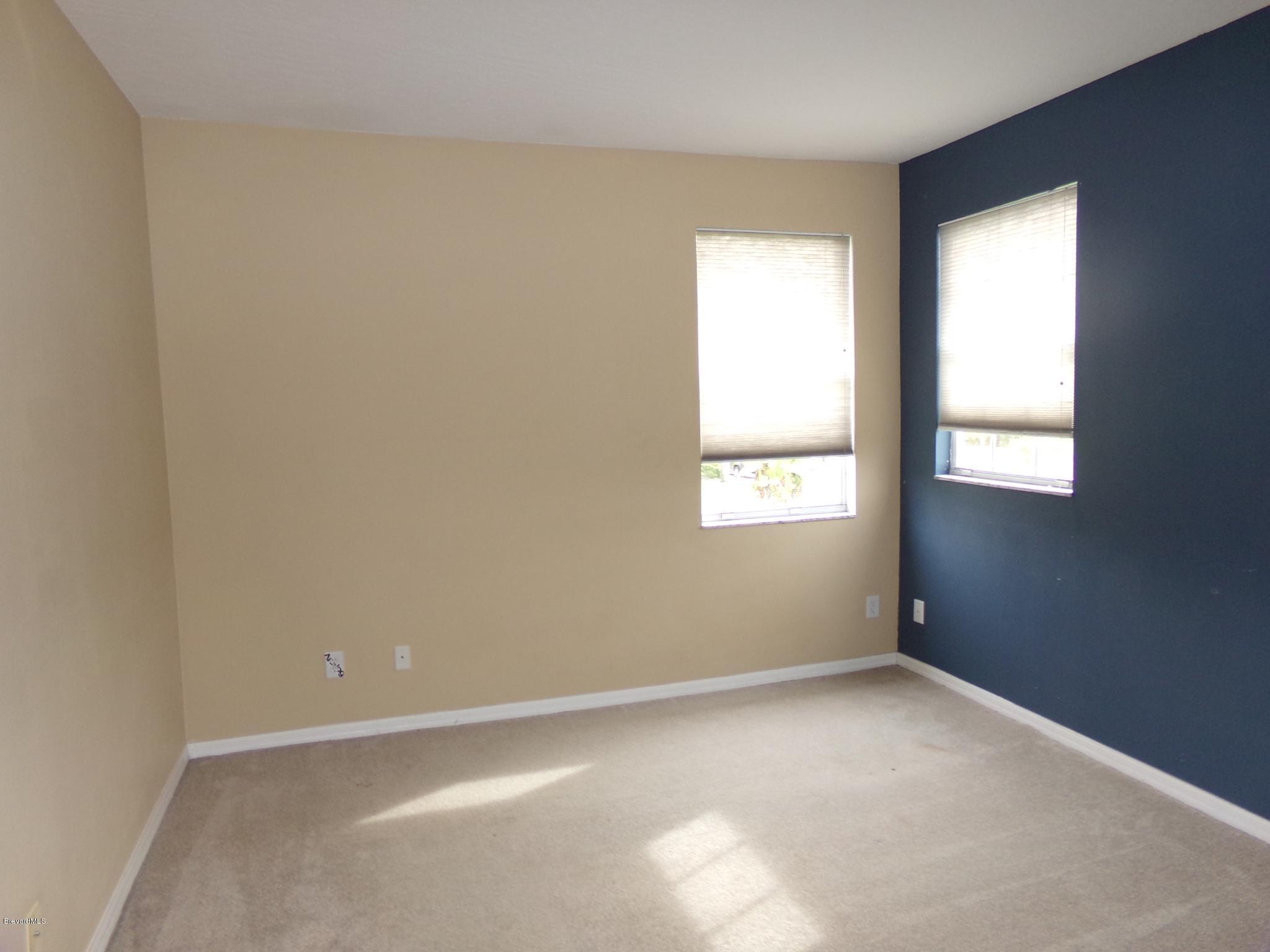 3995 Harlock Road Melbourne, FL 32934 - Photo 27 of 34 an empty room with windows