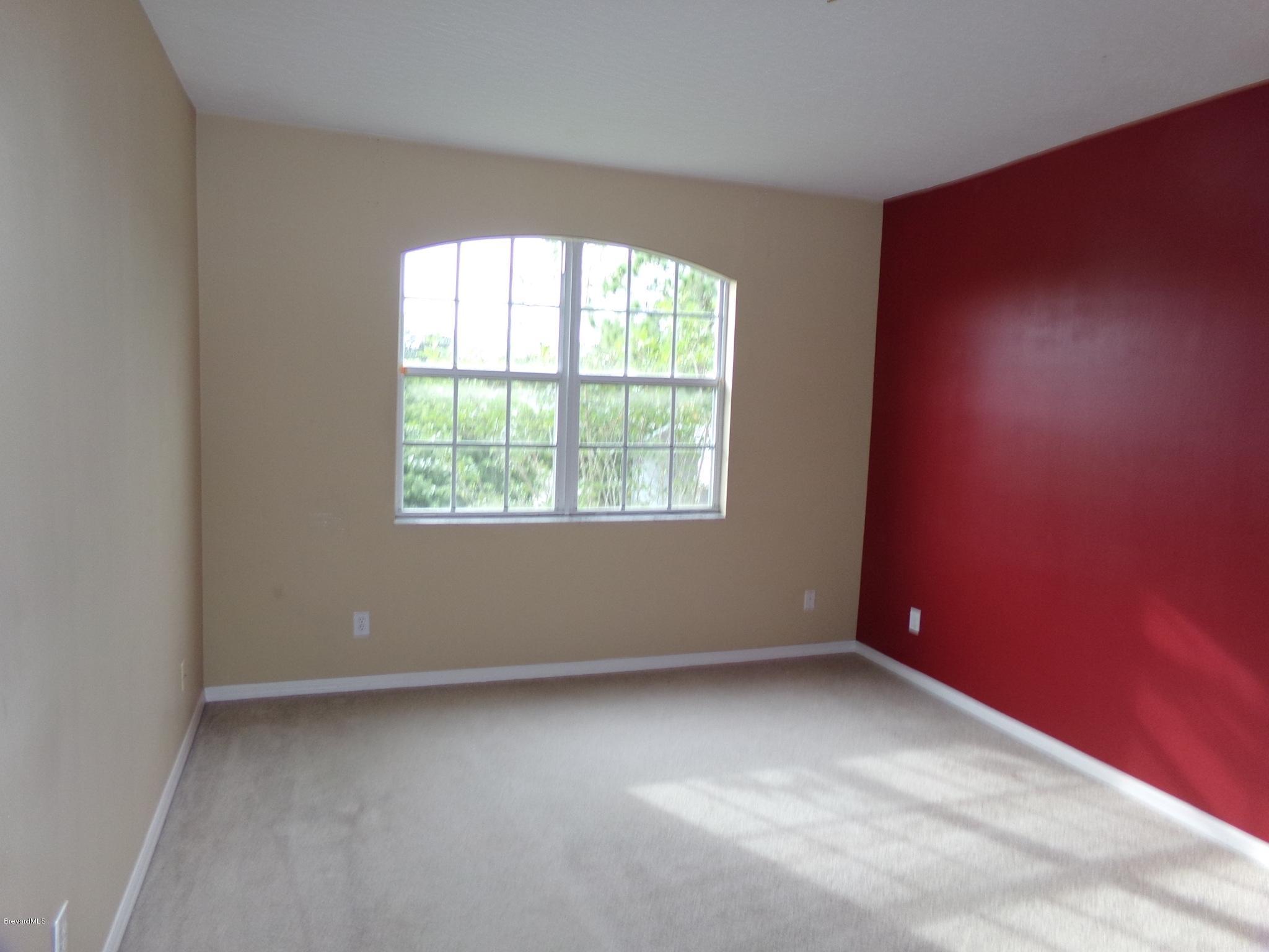 3995 Harlock Road Melbourne, FL 32934 - Photo 30 of 34 an empty room with a window
