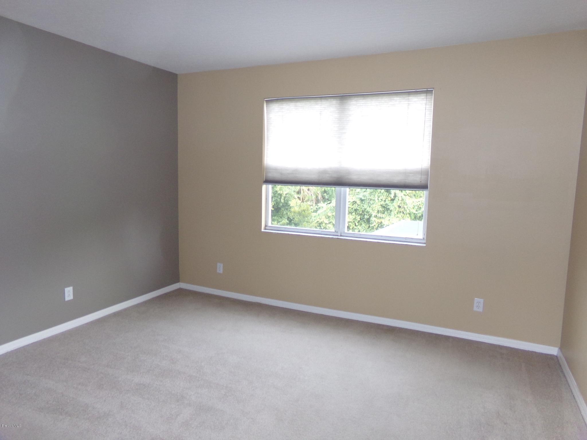 3995 Harlock Road Melbourne, FL 32934 - Photo 32 of 34 an empty room with a window
