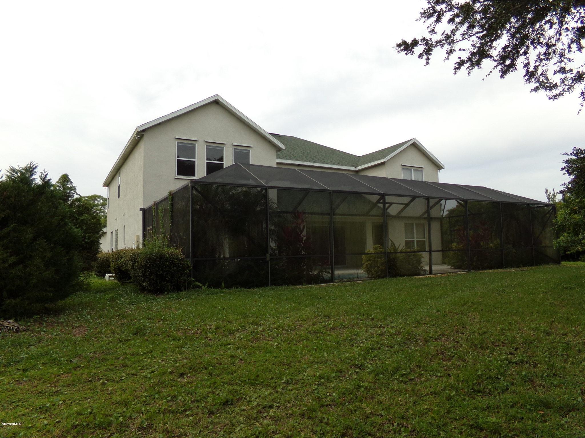 3995 Harlock Road Melbourne, FL 32934 - Photo 33 of 34 a view of a house with a yard and pathway
