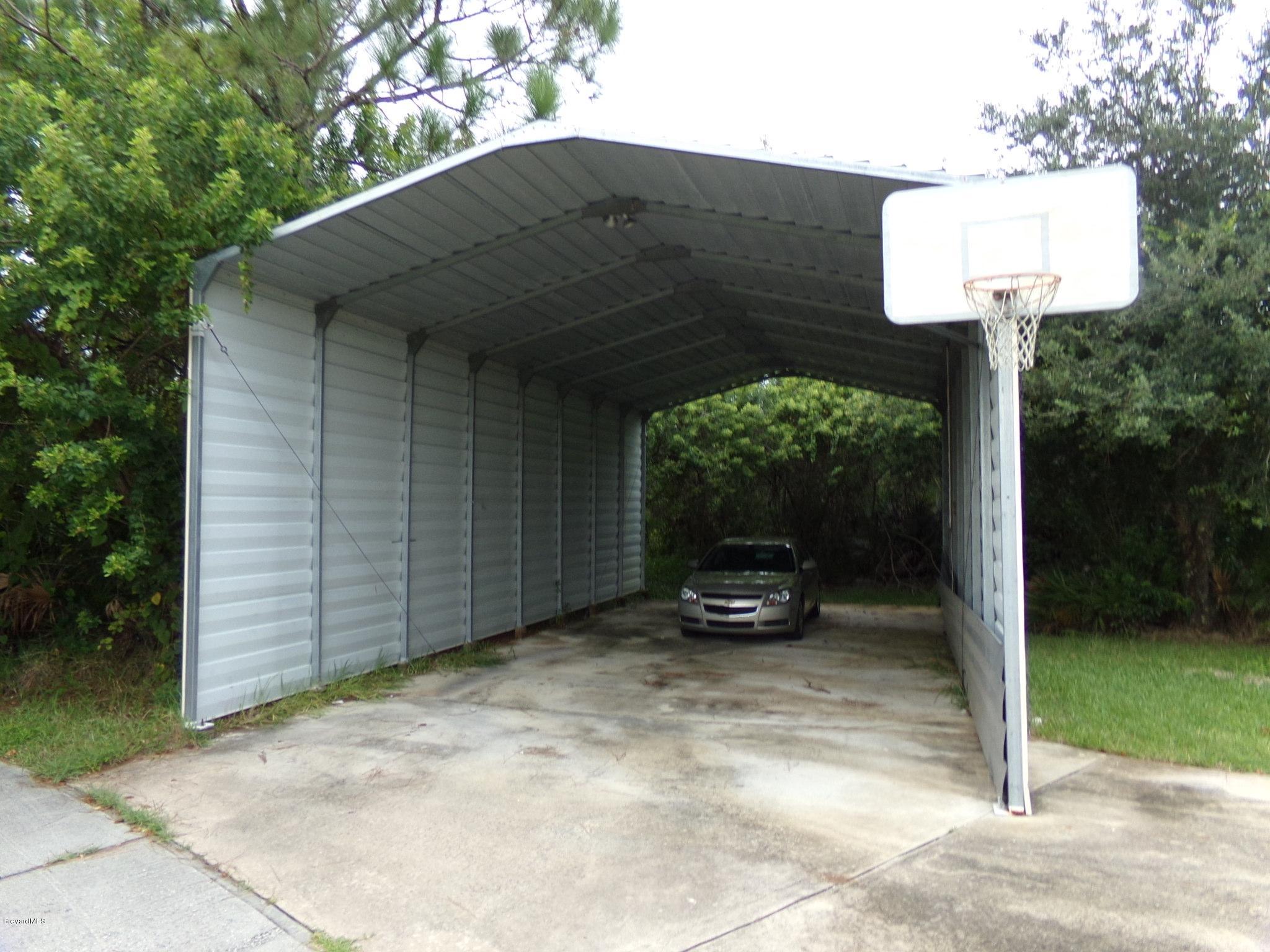 3995 Harlock Road Melbourne, FL 32934 - Photo 34 of 34 a front view of a house with garden