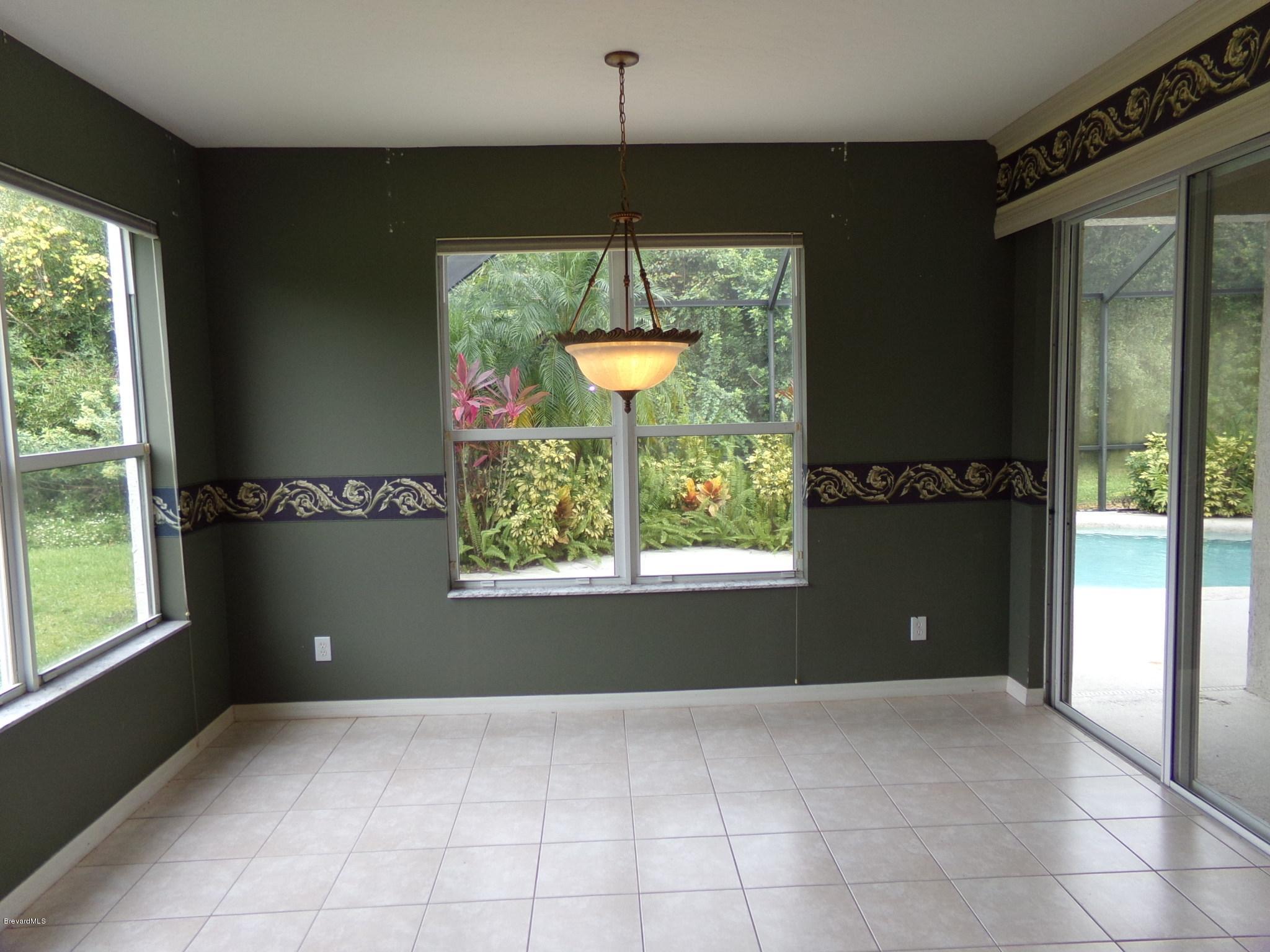 3995 Harlock Road Melbourne, FL 32934 - Photo 8 of 34 a view of an empty room with a window