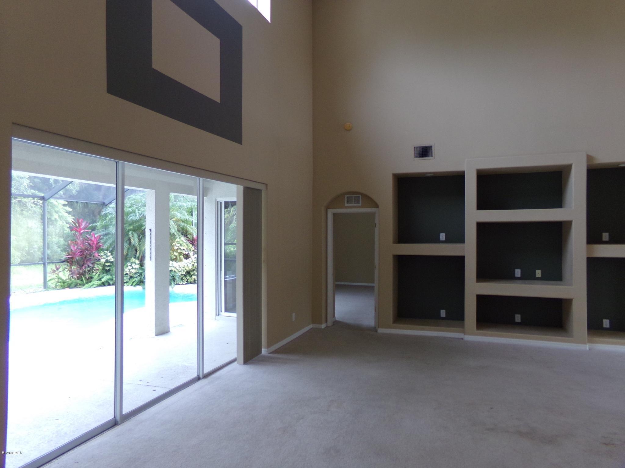 3995 Harlock Road Melbourne, FL 32934 - Photo 10 of 34 a view of an empty room with furniture and window