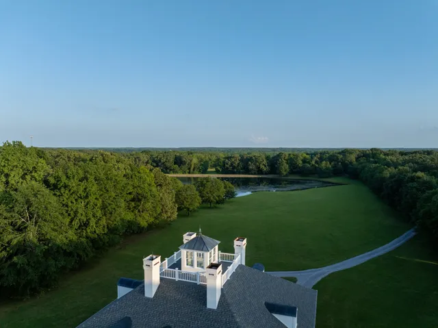 a view of a lake with a yard