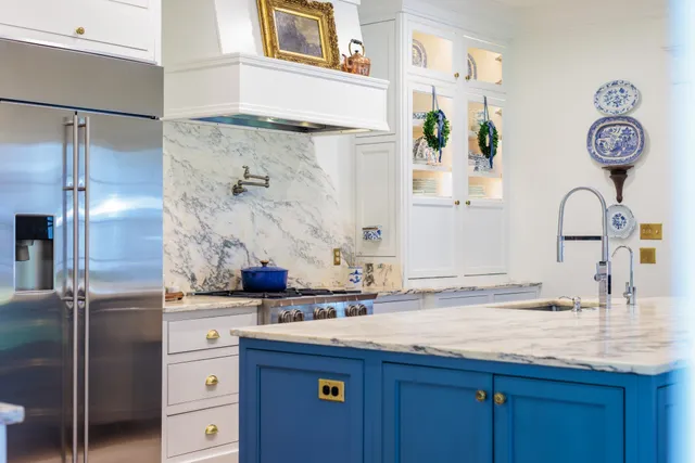 a spacious bedroom with a bed and a dresser in it